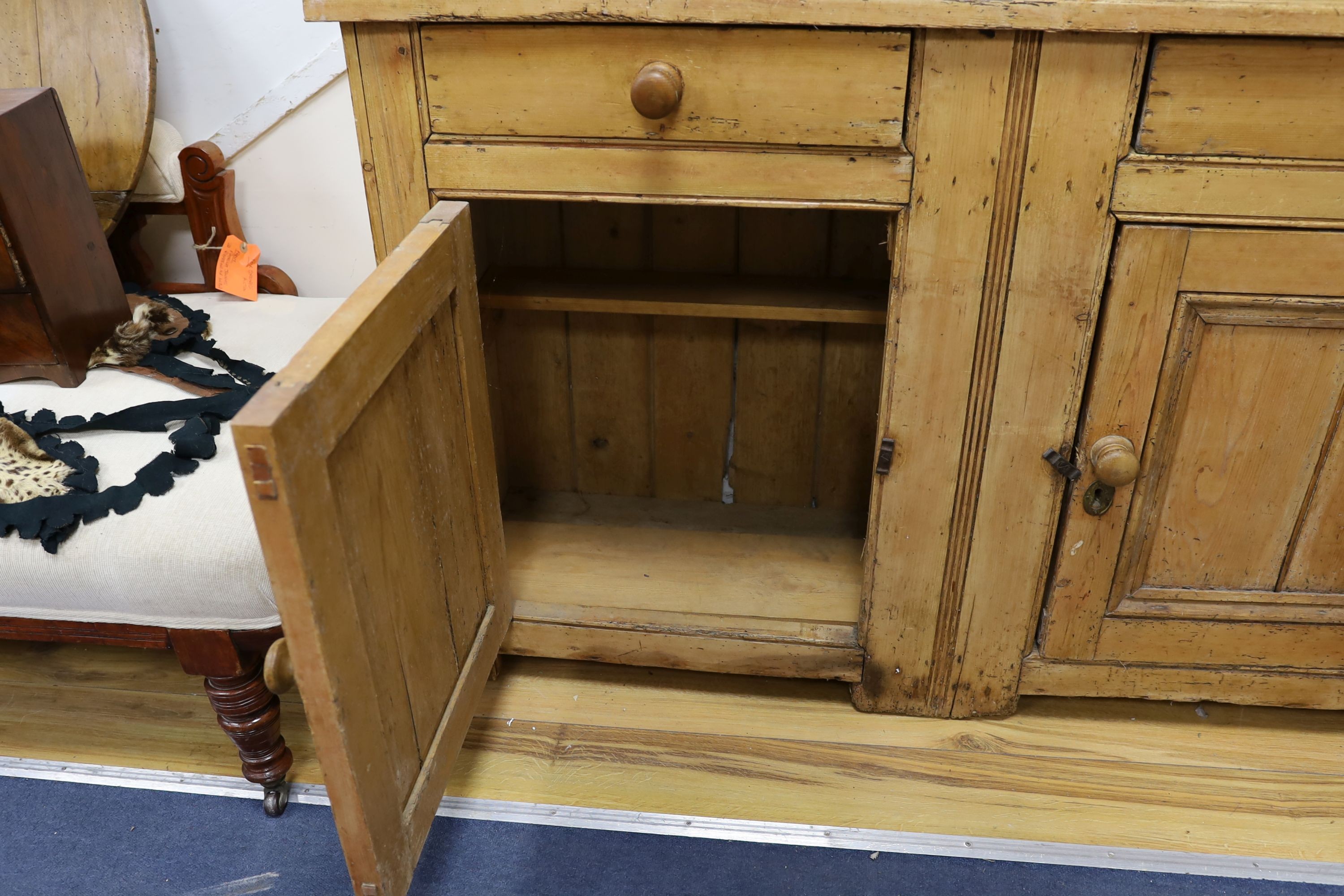 An early 19th century pine dresser, length 142cm, depth 43cm, height 208cm